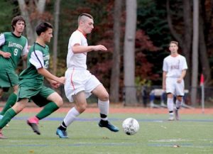 Junior Justin Byrnes moves past a defender during Walpole's victory over Dartmouth (1-0).