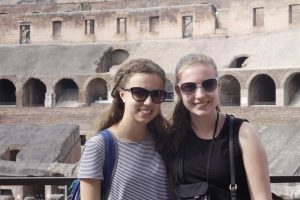 Junior Devin McKinney and Gayle McAdams smile for a photo at the Colosseum in Rome.