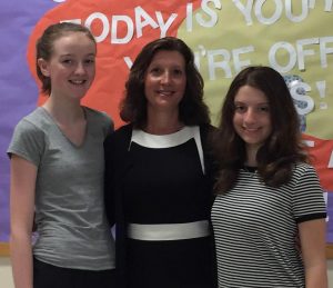 Mrs. Gough, the Bird Middle School Principal, stands with her students Brooke Lanchester on the left and Mikayla Preto on the right.