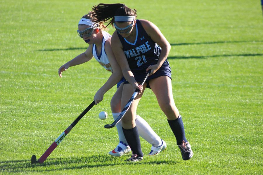 Senior Alex Rodia fights for the ball against Allie Martin in an earlier from this year.