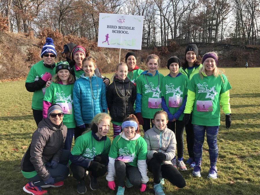 Lisa DeMarco poses with  the Heart and Sole program after running the 5k.