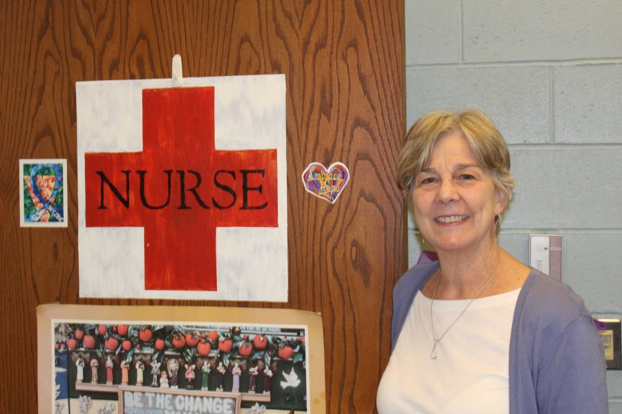 Prindall poses in front of her door after school. 