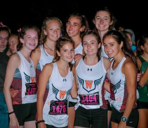 The varsity team poses before the start of the race (Photo/ David Forester).