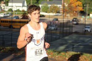 Nathan Shnaider races up Porker Hill. (Photo/ Kate McLellan)