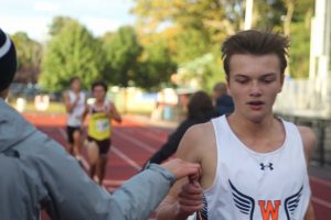 Dan Forester finishes in 9th place. Weymouth's third finisher comes in close behind him. (Photo/ Kate McLellan)