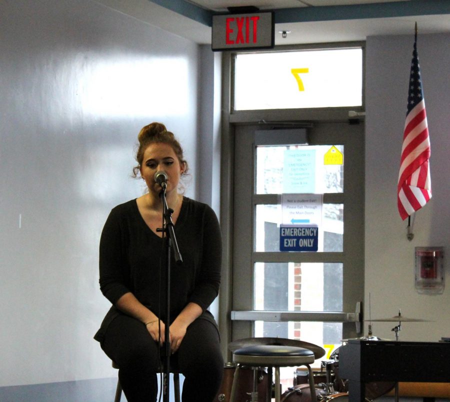 Senior Meghan Angelo performs at the Coffee House.
