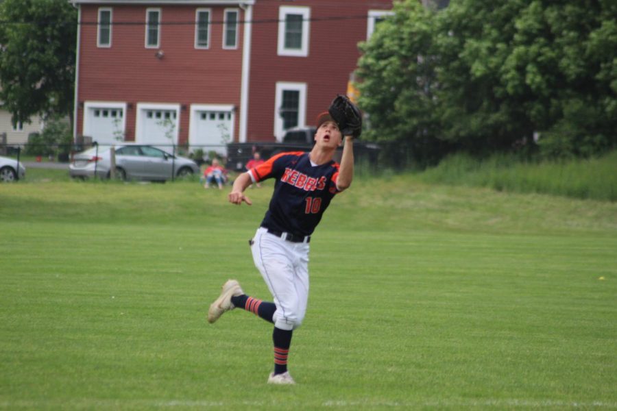 Junior outfielder, Will Jarvis, reaches for a pop fly hit to right field (Photo/Sarah St. George).