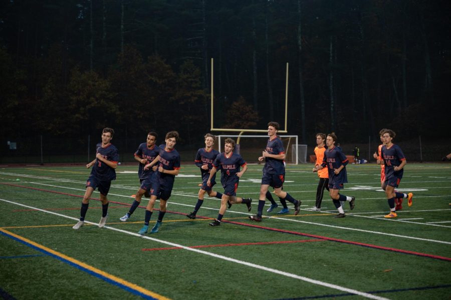 Boys soccer warms up before taking on Wellesley at home on Oct. 25. (Photo/The Searchlight)