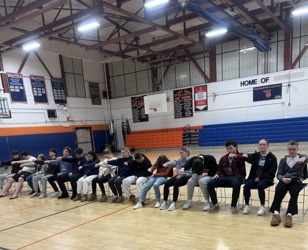 Students endure the effects of hypnotism in front of their peers
